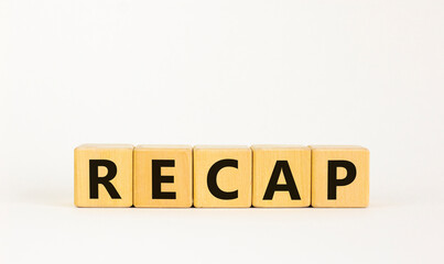 Recap symbol. The concept word 'recap' on wooden cubes on beautiful white table, white background,...