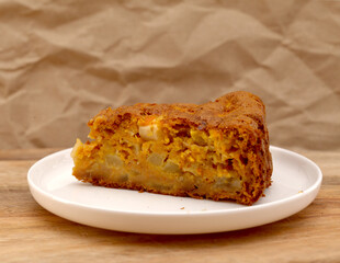 simple still life with apple and carrot cake and milk
surface of a freshly baked homemade apple and carrot cake 
