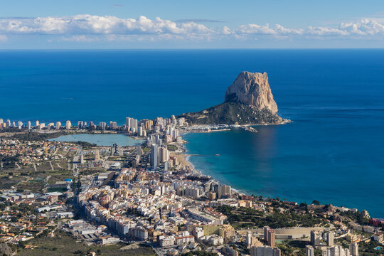 View of the blue Mediterranean Sea and the urban architecture of the coastal city of Calpe travel destination in Spain 