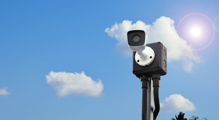 Mini ip cctv camera on pole with bluesky background, concept for security at home and monitoring.