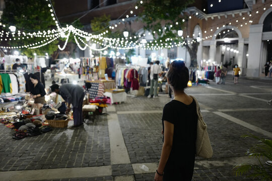 Series photo of young women shopping in night street market , Chaing mai north of thailand