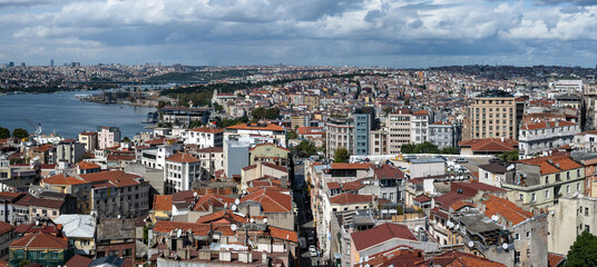ISTANBUL, TURKEY - OCTOBER 12 ,2021: Istanbul city view from Galata tower in Turkey. Golden Horn bay of Istanbul and Ataturk Bridge and Halic Bridge