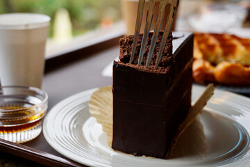 chocolate cake with fork at a cafe