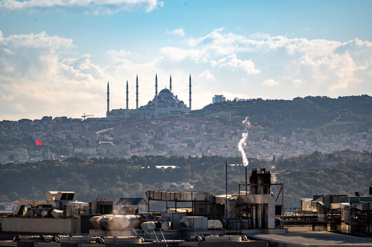 ISTANBUL, TURKEY - OCTOBER 12 ,2021: Istanbul city view on mosque with Uskudar district against blue sky and clouds.