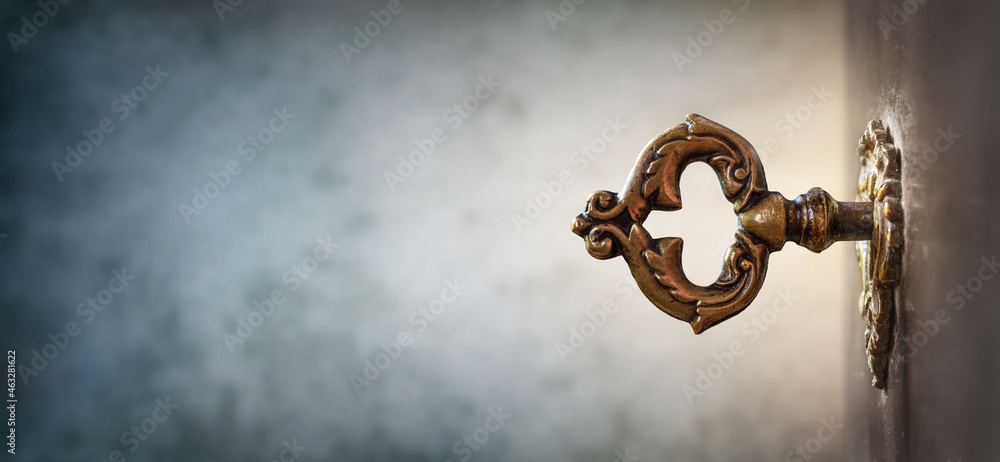 Poster old key in keyhole, macro shot. retro style. key to knowledge. concept and idea for history, educati