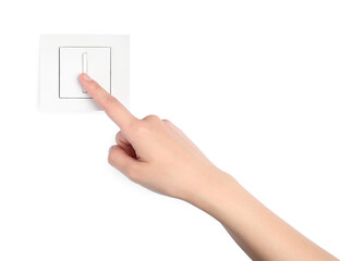 Woman pressing light switch on white background, closeup