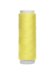 Spool of yellow sewing thread isolated on white