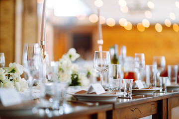 Festive table. Banquet table with wedding and festive serving. Wedding, birthday, party, event concept.