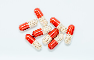 Tablets and capsules isolated on a white background a variety of medicinal medications for female...