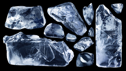 Set of many natural jagged pieces and shards of ice isolated on a black background.