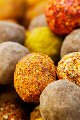 Belper Knolle cheese in the form of small balls. Small Swiss hard cheese balls Belper Knolle. Swiss cheese delicacy concept. Selective focus