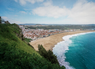 Fototapeta na wymiar Aerial view of Nazare City and Praia da Nazare Beach - Nazare, Portugal
