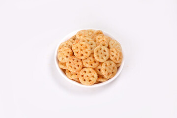 Fried and Spicy wheel Snacks or Fryums (Snacks Pellets) served in a bowl. selective focus - Image