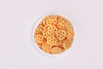 Fried and Spicy wheel Snacks or Fryums (Snacks Pellets) served in a bowl. selective focus - Image