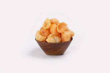 Fried and Spicy Moon Cup, Vatka, Katori, Moon Chips, Snacks or Fryums (Snacks Pellets) served in a bowl or White background. selective focus - Image