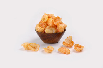Fried and Spicy Moon Cup, Vatka, Katori, Moon Chips, Snacks or Fryums (Snacks Pellets) served in a bowl or White background. selective focus - Image