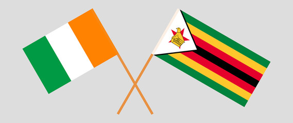 Fototapeta premium Crossed flags of Republic of Ivory Coast and the Republic of Zimbabwe. Official colors. Correct proportion