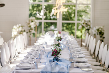 Table set for an event party or wedding reception. Banquet table design.