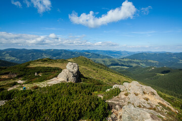 Fototapeta na wymiar A rock on top of the hill in Ukrainian Carpathians