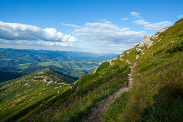 The hillside of the mountain with a narrow footpath on it, Carpathian mountains, Ukraine