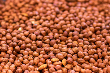 texture of peeled hazelnuts without shell, natural background, selective focus, side view