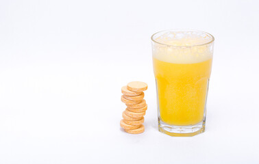 Glass with water on a white background with effervescent tablets vitamins