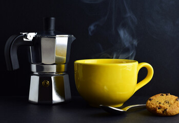 Yellow, hot mug, rising smoke, coffee pot in outline, black background and copy space.
