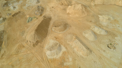 Open pit gravel mining. Large piles of construction sand and gravel used for asphalt production and...