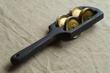 Black wooden rhythm clapper (rumba, pandeira) - a noise folk musical instrument with a handle and...