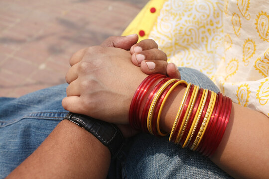 Point-of-view (POV) of a man holding a woman's hand