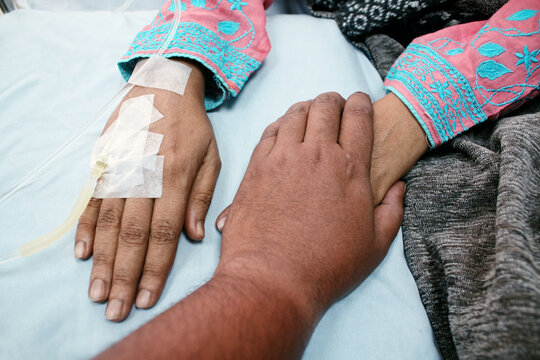 Point-of-view (POV) of a man holding a woman's hand