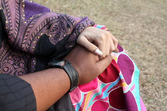 Point-of-view (POV) of a man holding a woman's hand