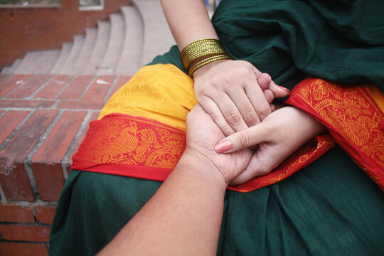 Point-of-view (POV) of a man holding a woman's hand