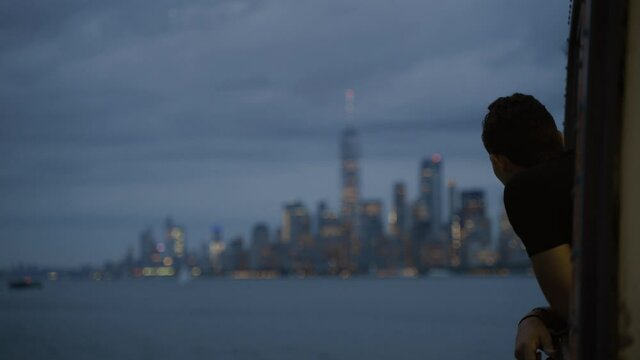 New York Manhatten side with Hudson River. Downtown Manhatten in evening light as seen from the Ferry to Staten Island. Twillight. Big city life, travel, transportation and adventure, tourism concept