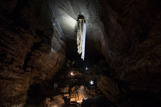 illuminated large stalactite in doolin cave in ireland