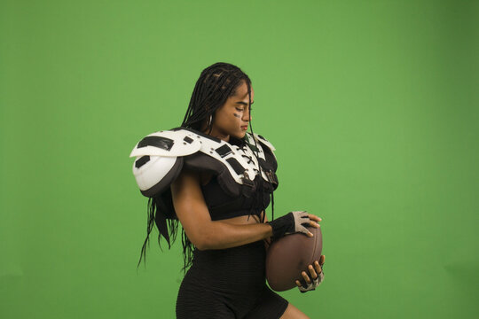 Woman With Braids And American Football Shoulder Pads