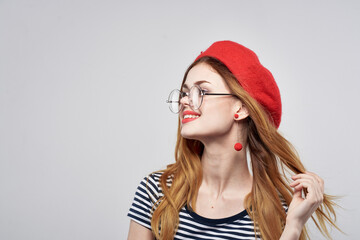 pretty woman in a striped t-shirt red lips gesture with his hands lifestyle