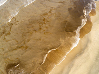 Aerial view of waves and sand at Monte Athos beach
