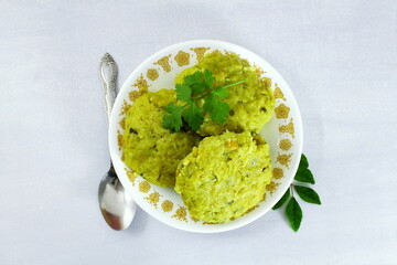 traditional indian gujarati spicy snack food kapuriya gora or kapuria gola steamed rice lentils cakes