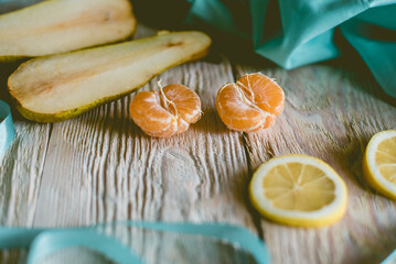 Fototapeta na wymiar Citrus fresh fruits on a wooden table, close-up.