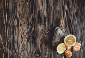 Lots ripe citrus on wooden background