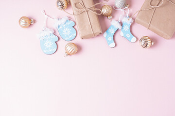 Gift boxes and Christmas decorations on pink background. Copy space. Christmas frame