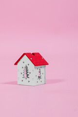 installation with winter background with a house wrapped in warm scarf