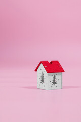 installation with winter background with a house wrapped in warm scarf