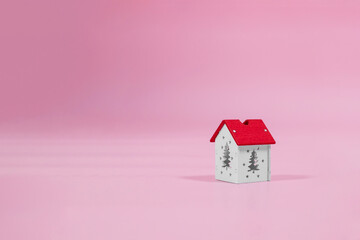 installation with winter background with a house wrapped in warm scarf