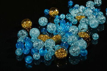 blue beads balls on black mirror background