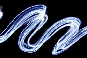 Long exposure photograph of bright white light in an abstract swirl, smokey waves pattern against a...