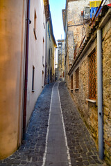 A narrow street of Strangolagalli, a medieval town of Lazio region, Italy.