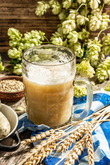 Oktoberfest set. Unfiltered beer, weisswurst, spikelets of grain, hop