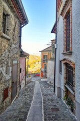 A narrow street of Strangolagalli, a medieval town of Lazio region, Italy.